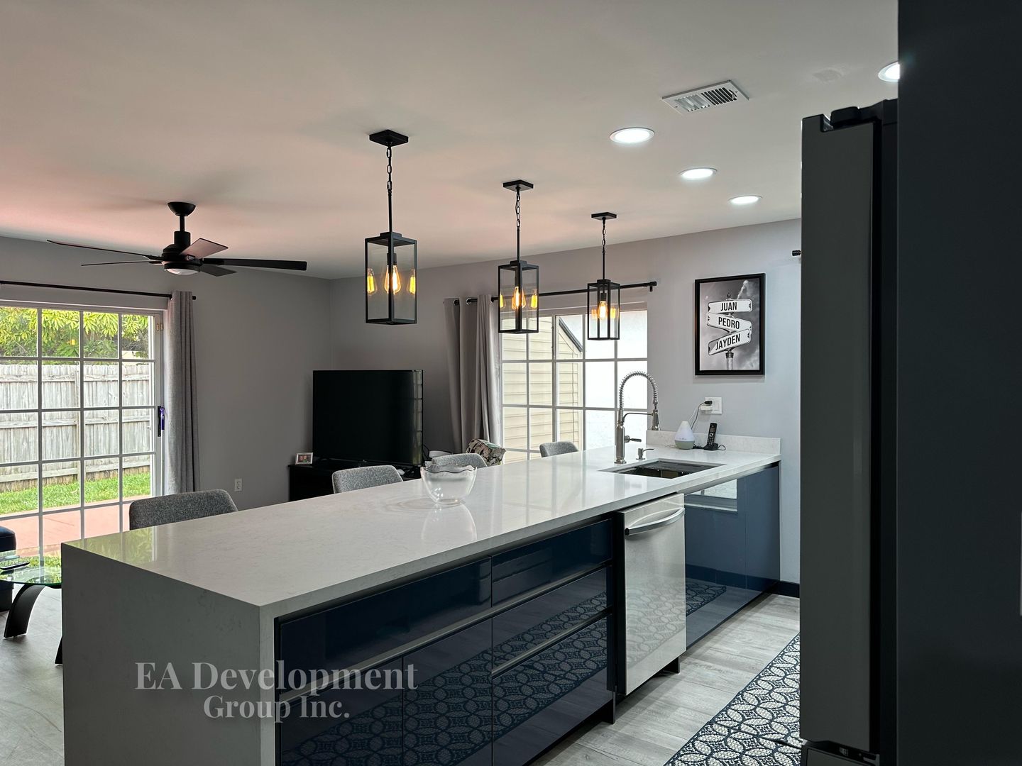 Kitchen renovation after — wide view toward living area