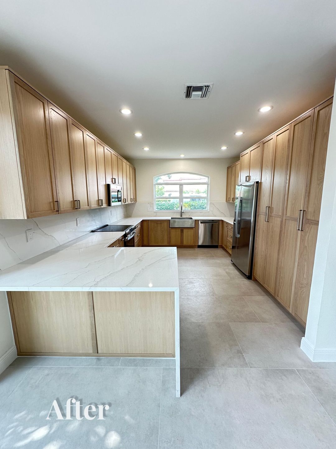 Kitchen renovation after — full kitchen view toward the window