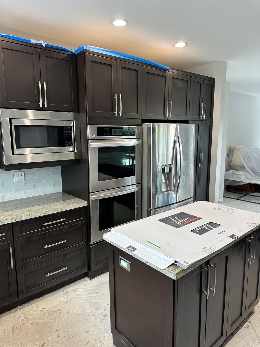 Kitchen renovation before — original dark espresso cabinetry, cabinets freshly installed