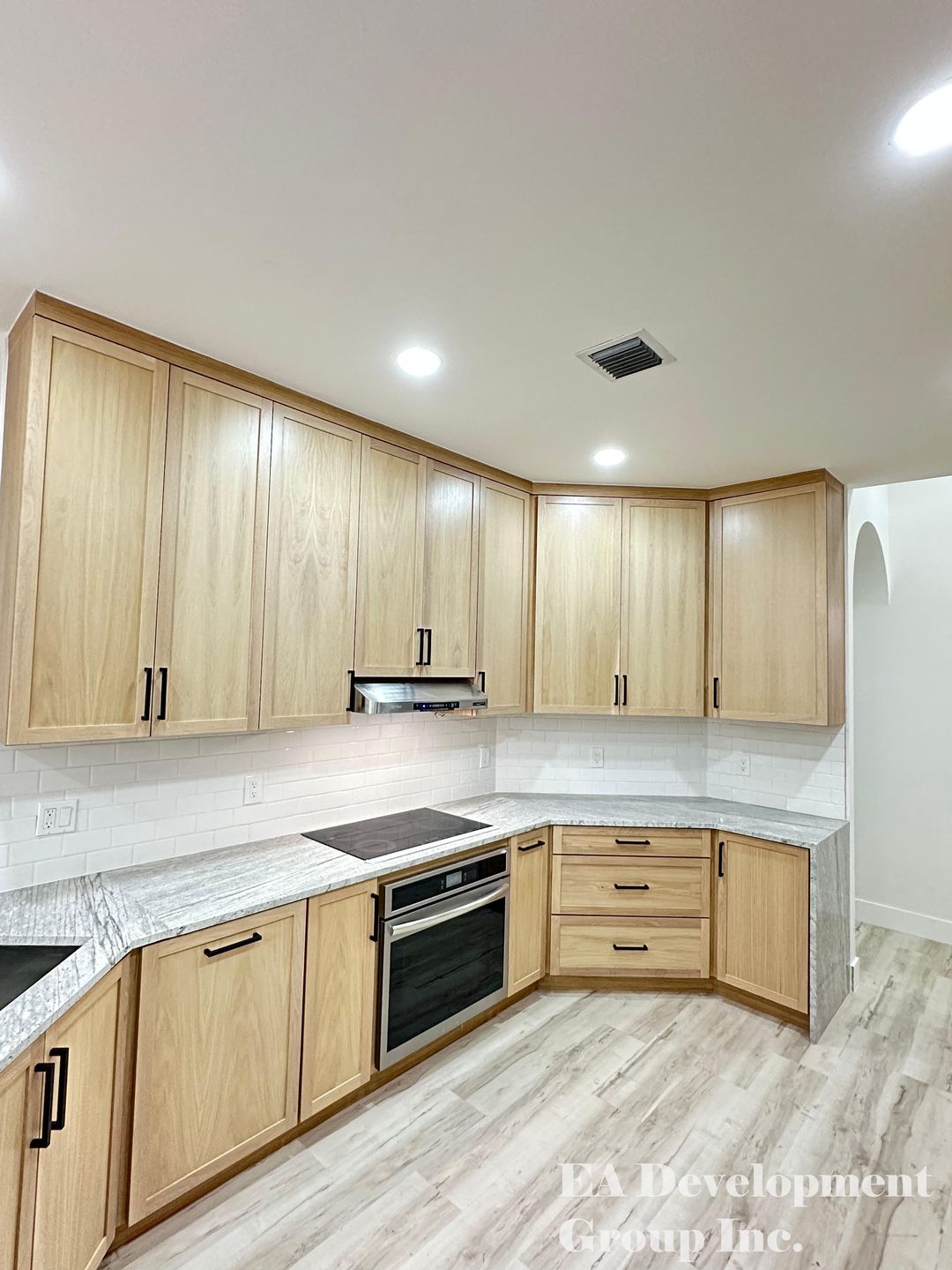 Kitchen renovation after — corner cabinetry with subway tile backsplash