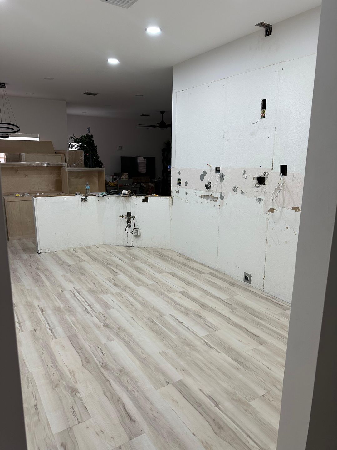 Kitchen renovation before — gutted kitchen down to drywall